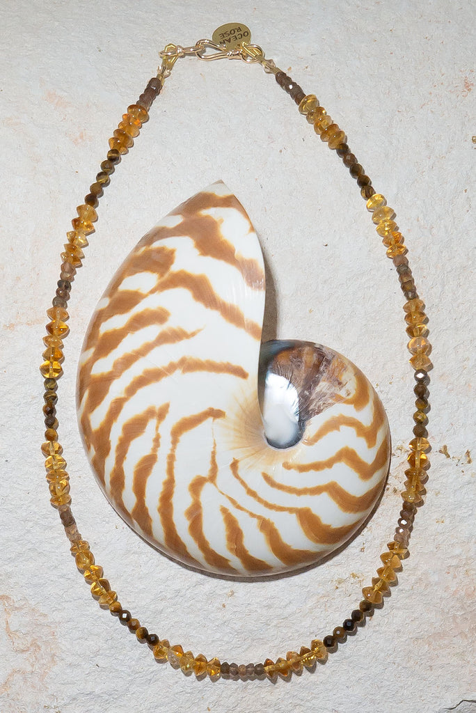 Inspired by the golden warm hues of a rolling desert. This gorgeous gemstone necklace features shimmer, sparkle and shine.
