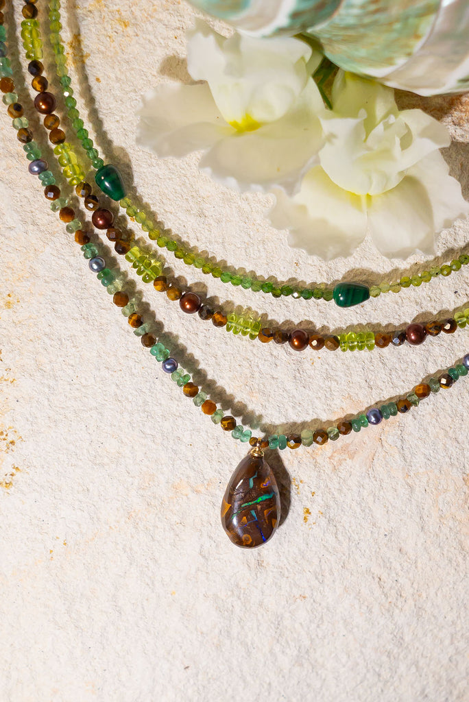 A beautiful blend of earthy brown hues, shimmering pearls and gorgeous greens. This is enchanting necklace is inspired by the colours of a tropical Queensland rainforest.