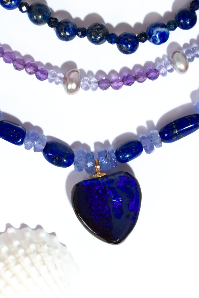 Fall in love with the deep jewel tones of this magical gemstone &amp; opal necklace. Deep blue lapis lazuli and shimmering tanzanite beautiful compliment the dark blue and purple fire found in the gorgeous Australian boulder opal heart pendant.