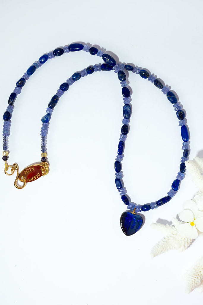 Fall in love with the deep jewel tones of this magical gemstone &amp; opal necklace. Deep blue lapis lazuli and shimmering tanzanite beautiful compliment the dark blue and purple fire found in the gorgeous Australian boulder opal heart pendant.