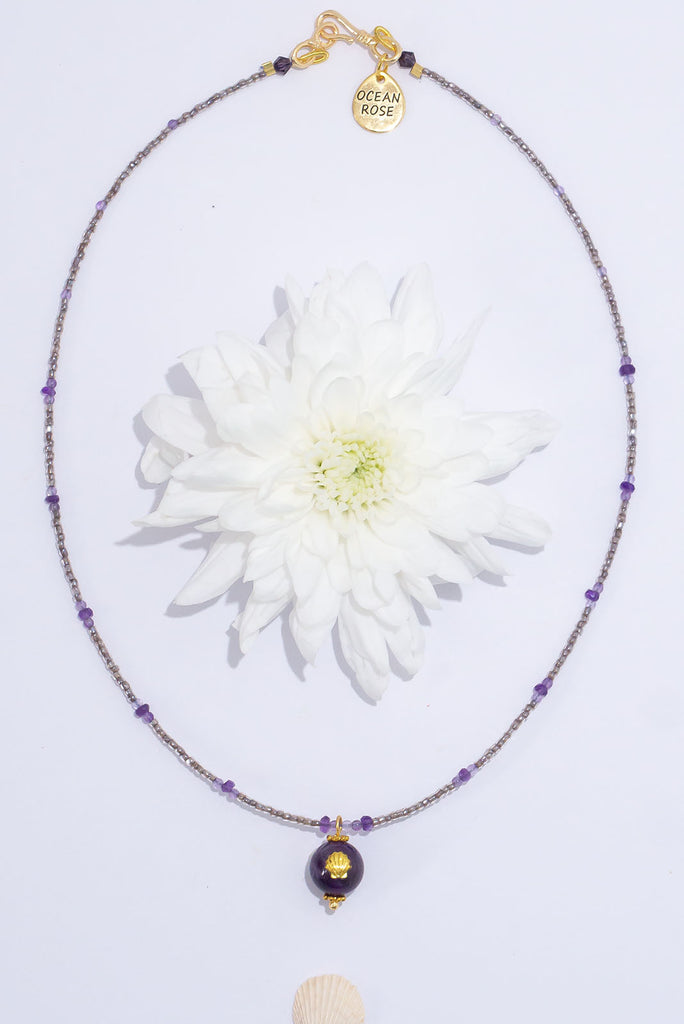This delicate stand of soft purple luminescent beads will shimmer and shine.