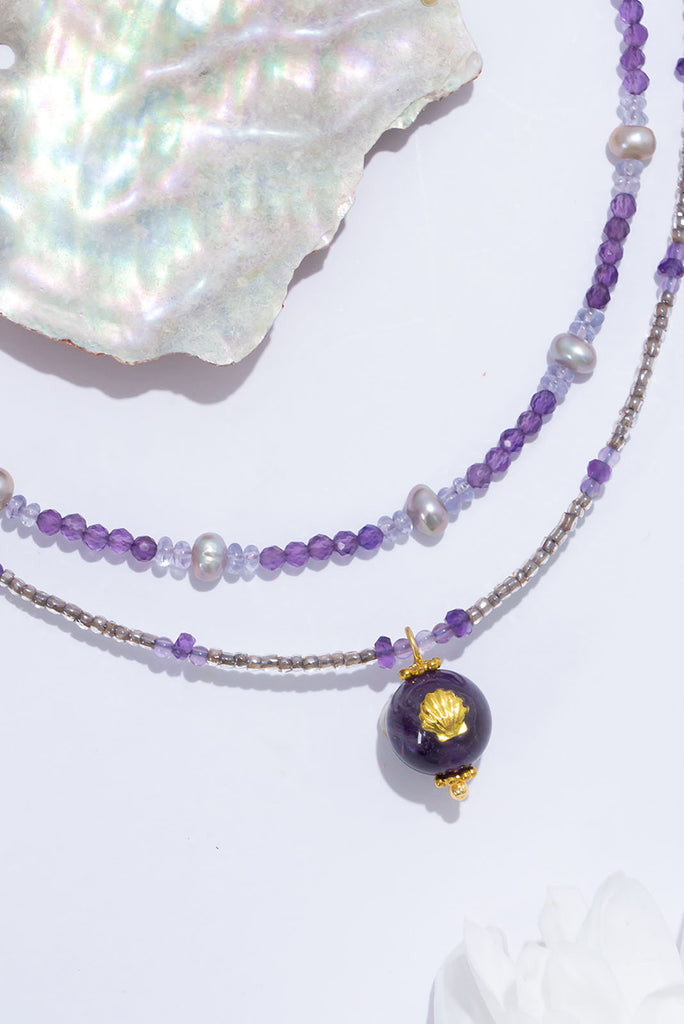 This delicate stand of soft purple luminescent beads will shimmer and shine.