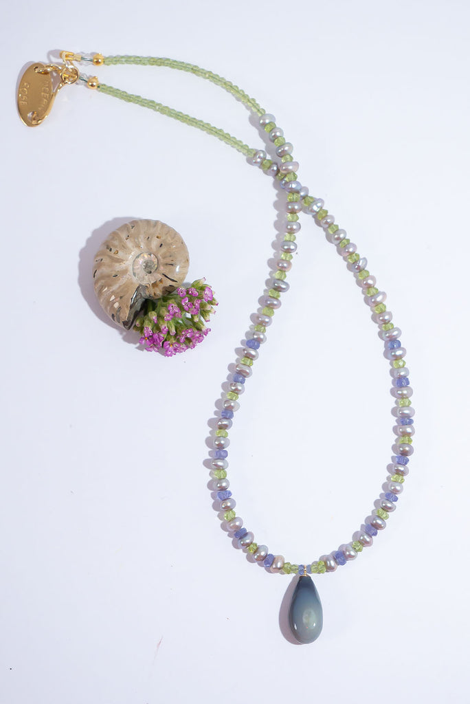Like the colours of Spring shimmering in the early hours of a misty morning this enchanting necklace is full of magic.