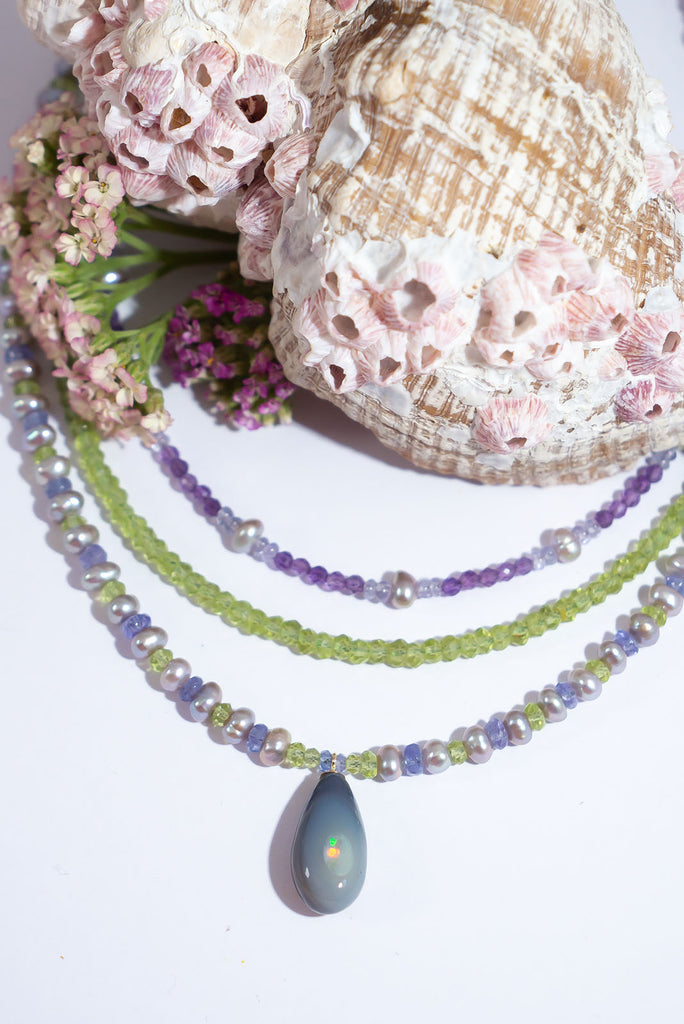 Like the colours of Spring shimmering in the early hours of a misty morning this enchanting necklace is full of magic.