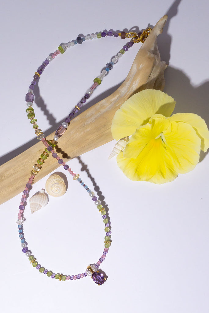 So romantic, this delicate softly coloured necklace has a perfect faceted Amethyst stone as a centrepiece it's set between a modern chic and classic romantic style.&nbsp;