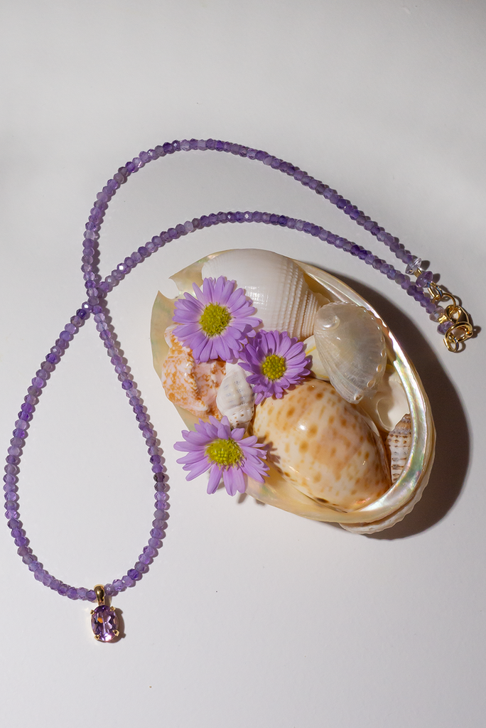 A romantic Amethyst necklace, it is perfectly set between a modern chic and classic romantic style. This pretty piece has a faceted Amethyst gemstone set in 9ct gold vermeil as the centrepiece