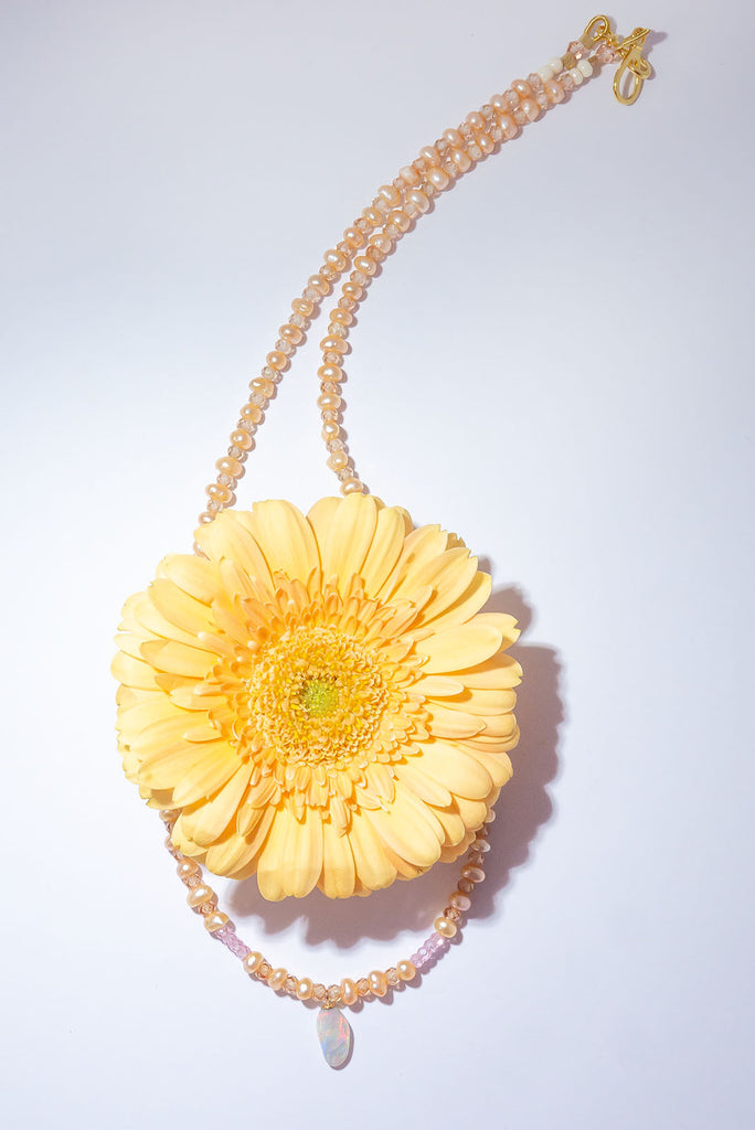 The palest peachy pink pearls and a tiny drop of crystal Opal, this darling necklace is so feminine and utterly adorable.