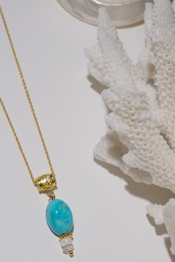 An exquisitely delicate Arizona Turquoise gemstone necklace, naturally sourced and complemented by a gold-plated chain and findings.