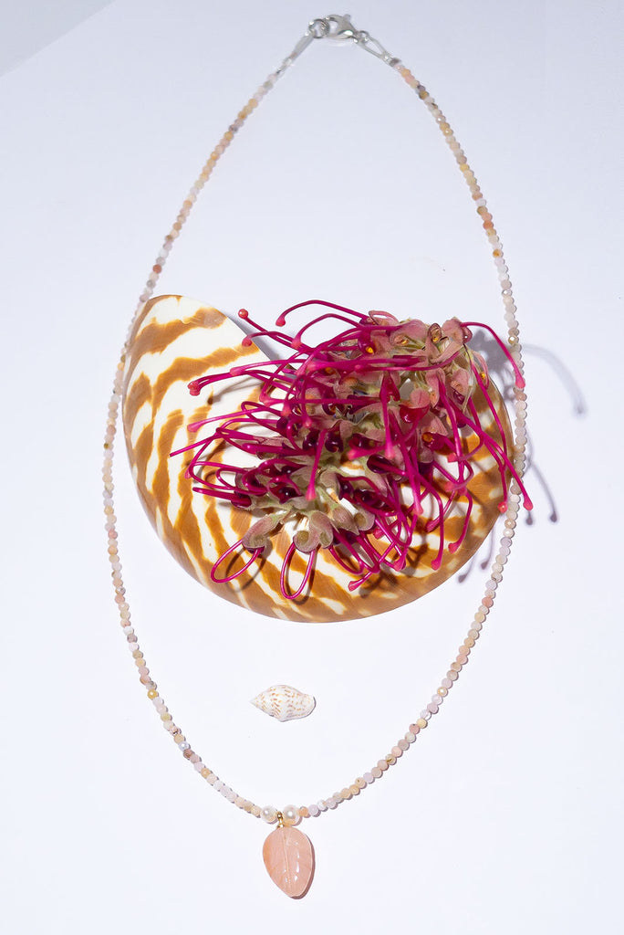 Little darling so subtle and pretty, palest pink Agate hand carved into a leaf and strung on the tiniest pink Opal beads. This is divine.