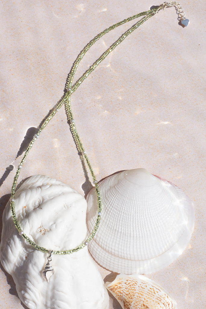 This delicate necklace shimmers and shines in the sunlight. It features an enchanting sterling silver seashell pendant.