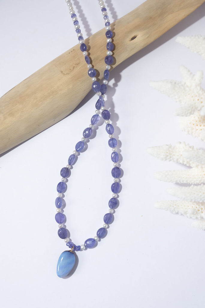 Fall under the spell of this enchanting periwinkle blue creation.