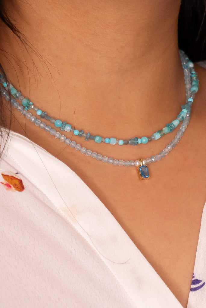 As beautiful as a clear blue sky day, this blue Topaz necklace with the perfect faceted stone as a centrepiece is perfectly set between a modern chic and crystal dreaming.