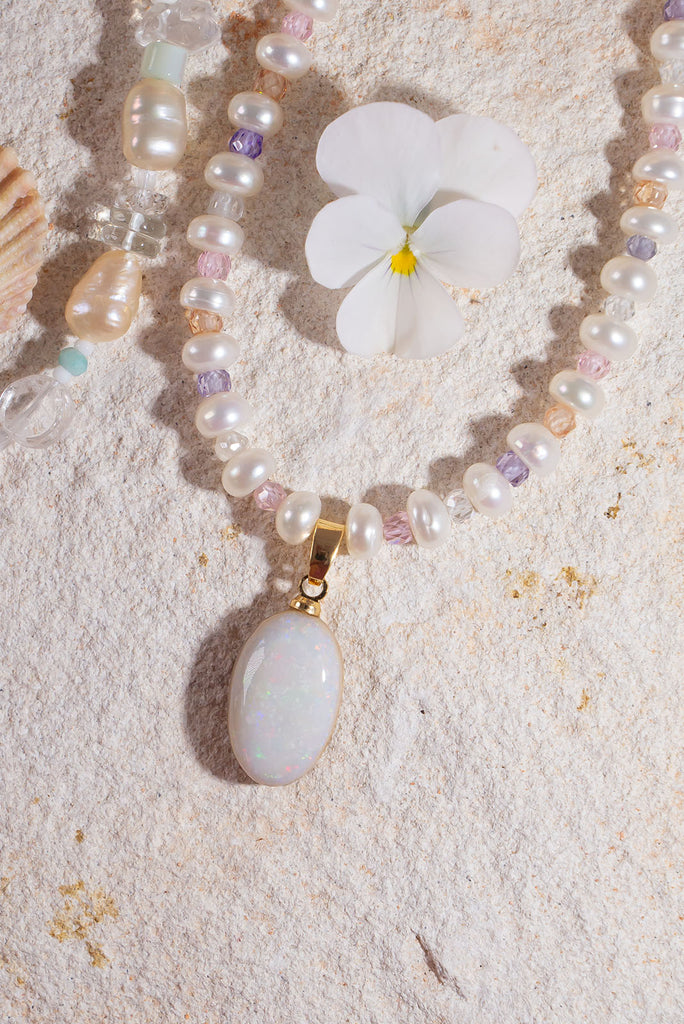 Snowdrops and roses, this solid Australian Opal has soft subtle flashes deep pink, green and mauve, pearls interspaced with sparkling faceted gemstone beads, so cool and quiet.