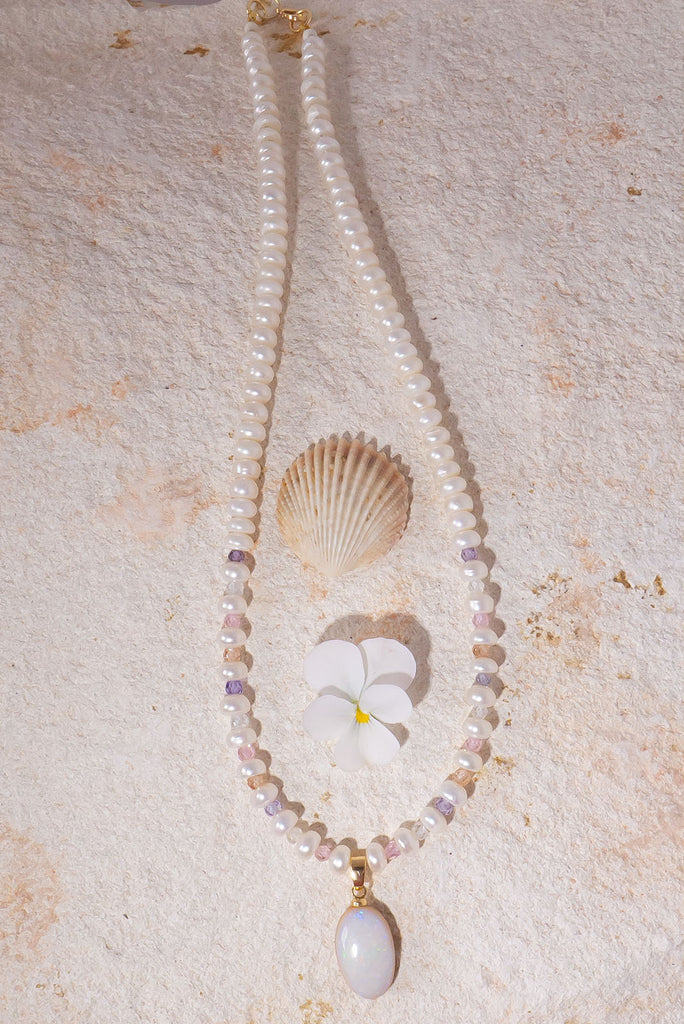Snowdrops and roses, this solid Australian Opal has soft subtle flashes deep pink, green and mauve, pearls interspaced with sparkling faceted gemstone beads, so cool and quiet.