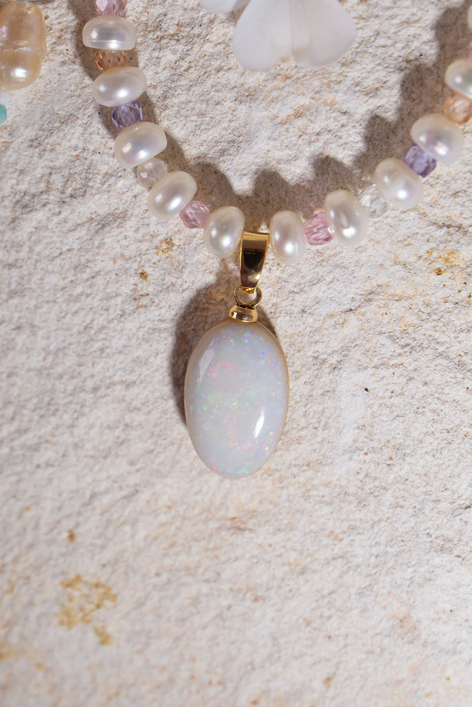 Snowdrops and roses, this solid Australian Opal has soft subtle flashes deep pink, green and mauve, pearls interspaced with sparkling faceted gemstone beads, so cool and quiet.