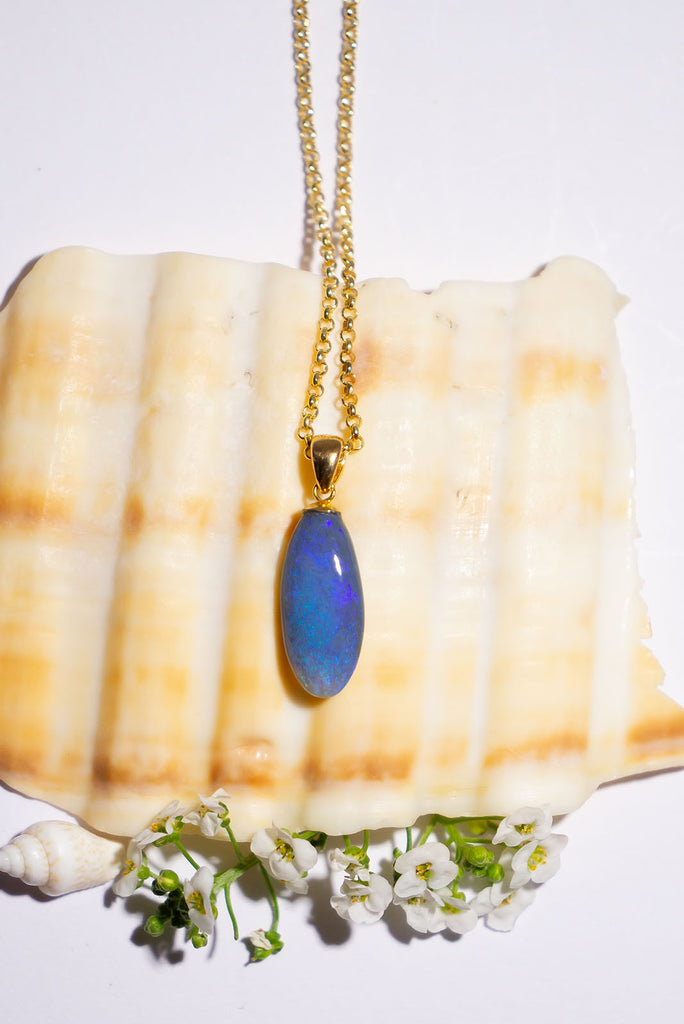 An elegant droplet of blue, this semi black pendant is perfectly chic and softly feminine.