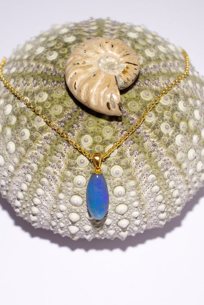 An elegant droplet of blue, this semi black pendant is perfectly chic and softly feminine.