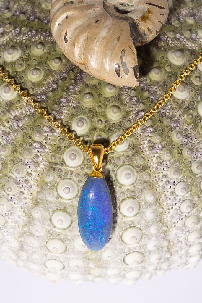 An elegant droplet of blue, this semi black pendant is perfectly chic and softly feminine.