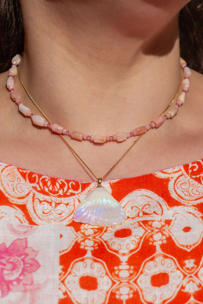 An absolute stunner, this mystical crystal opal skilfully carved into the shape of a whale tail, a dreamy and tactile opal pendant that is a one off piece.