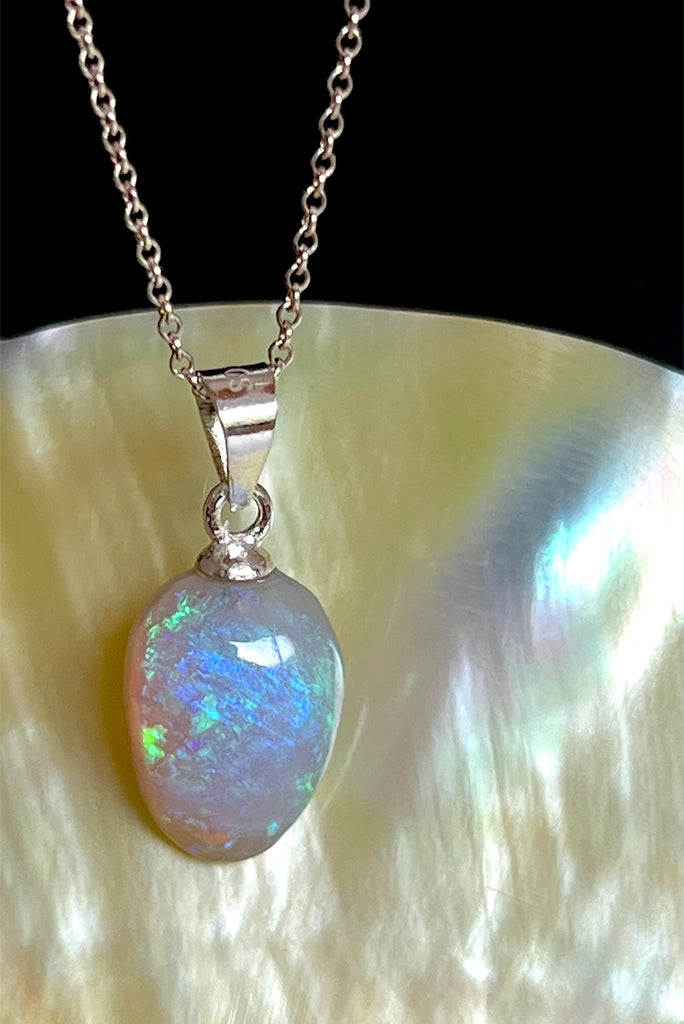 A tiny slip of perfection, crystalline detail that reveals soft flashes of green, pink, blue and mauve through the stone.. This piece has a magical glow.. Solid Australian Crystal Opal.