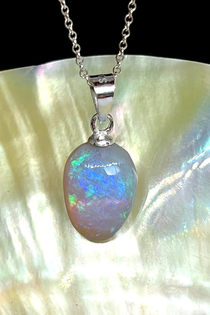 A tiny slip of perfection, crystalline detail that reveals soft flashes of green, pink, blue and mauve through the stone.. This piece has a magical glow.. Solid Australian Crystal Opal.