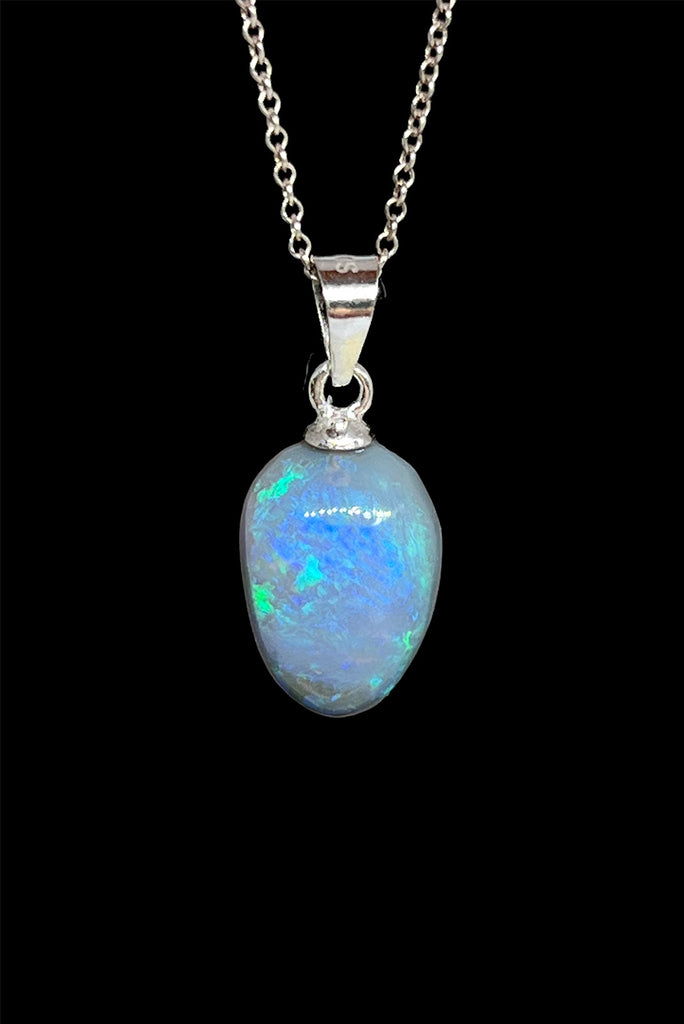 A tiny slip of perfection, crystalline detail that reveals soft flashes of green, pink, blue and mauve through the stone.. This piece has a magical glow.. Solid Australian Crystal Opal.
