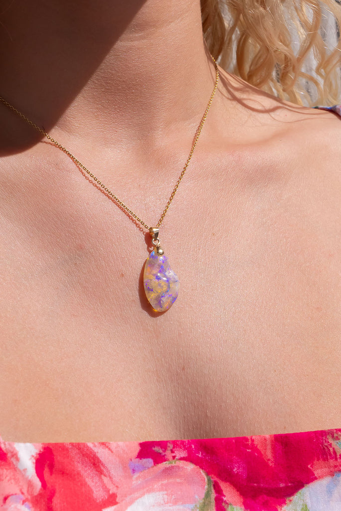An absolutely stunning opal pendant featuring a soft droplet of Australian crystal opal cut and polished to reveal the wonderful colour and sand  that reveals itself underneath.