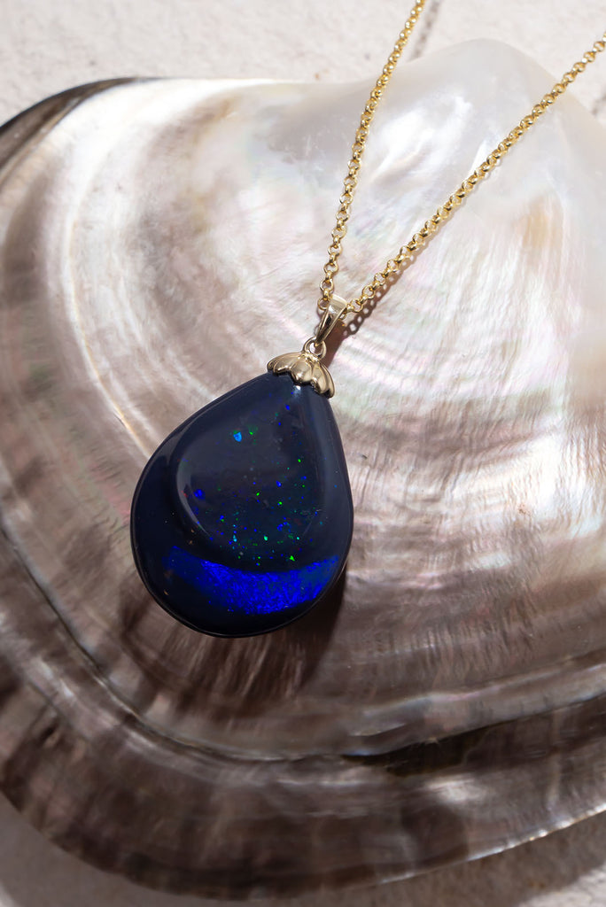 Like a distant galaxy shimmering at the edge of the universe this gorgeous opal will enthral you. With 2 distinct bands of different fire and pattern this is a truly exception piece.