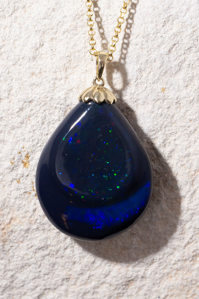 Like a distant galaxy shimmering at the edge of the universe this gorgeous opal will enthral you. With 2 distinct bands of different fire and pattern this is a truly exception piece.