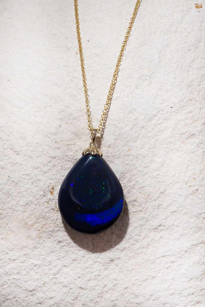 Like a distant galaxy shimmering at the edge of the universe this gorgeous opal will enthral you. With 2 distinct bands of different fire and pattern this is a truly exception piece.