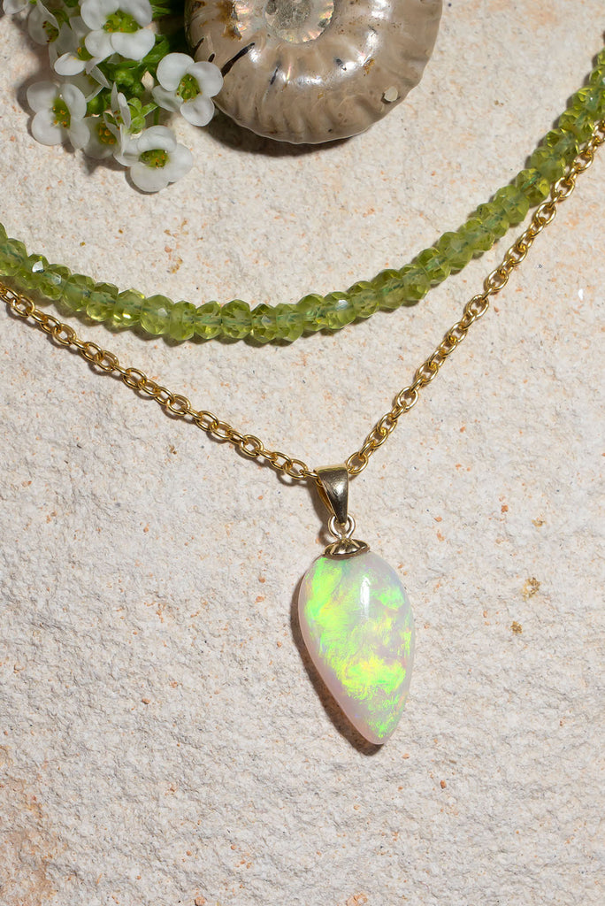 A flash of green as it dances across the sky, there is a bright luminous rolling flash of green in this enthralling opal pendant is absolutely unique, its even more beautiful in the sunshine.