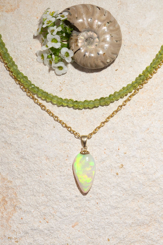 A flash of green as it dances across the sky, there is a bright luminous rolling flash of green in this enthralling opal pendant is absolutely unique, its even more beautiful in the sunshine.