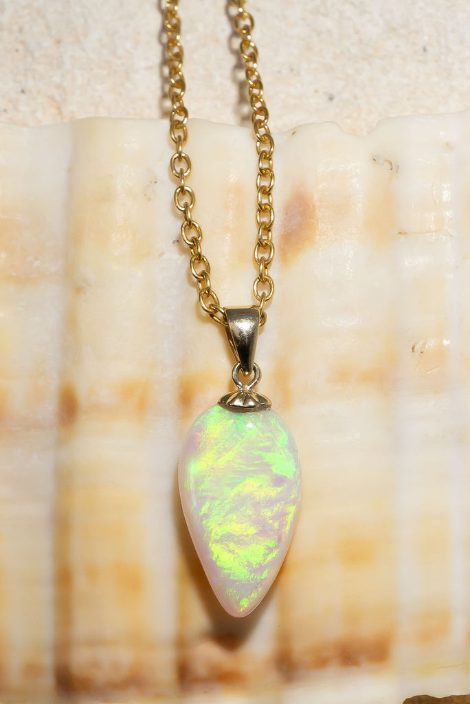 A flash of green as it dances across the sky, there is a bright luminous rolling flash of green in this enthralling opal pendant is absolutely unique, its even more beautiful in the sunshine.