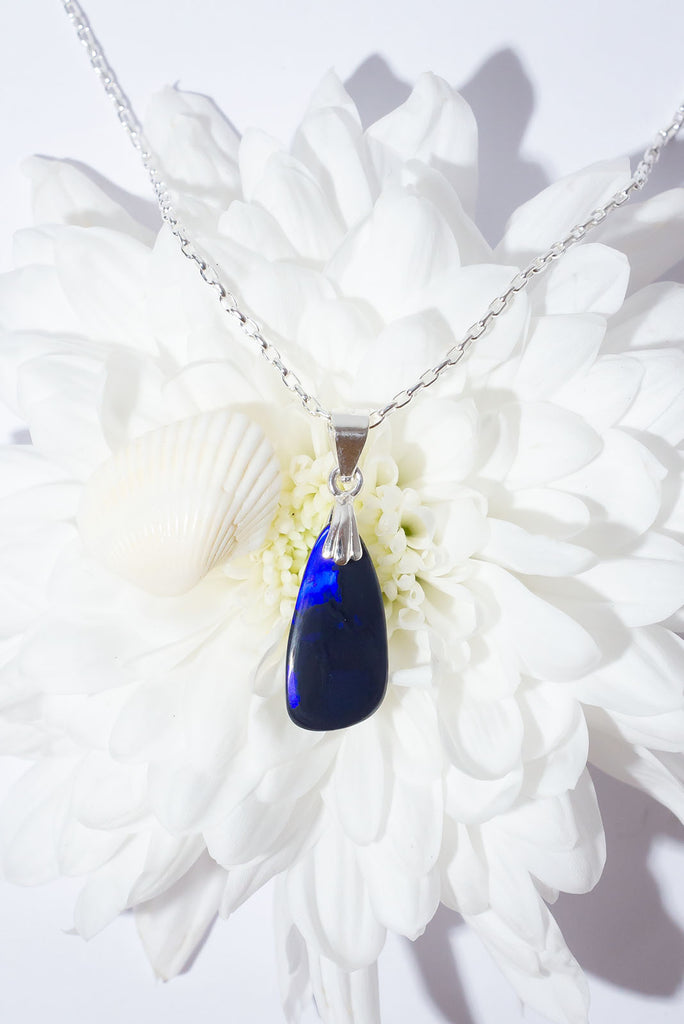 A mysterious secret, this Black Opal pendant has a story to tell or maybe we wont ever know.