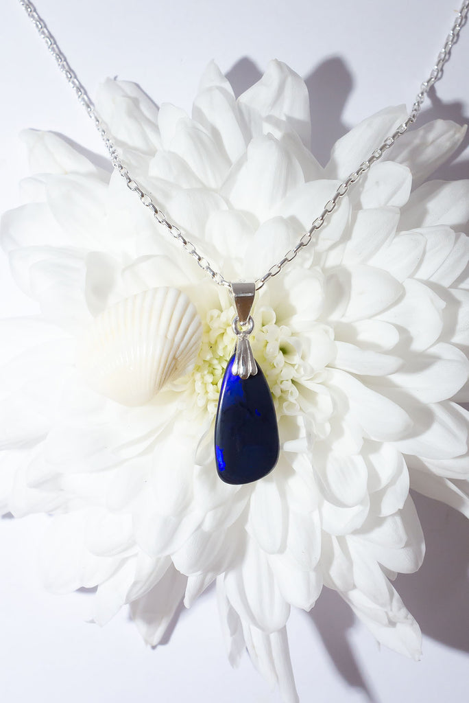 A mysterious secret, this Black Opal pendant has a story to tell or maybe we wont ever know.