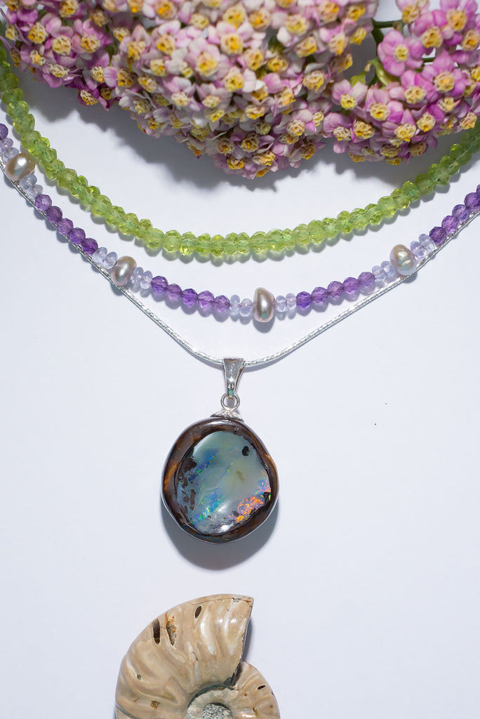 Discover a shimmering rainbow of colours in this magical Australian Boulder Opal piece.
