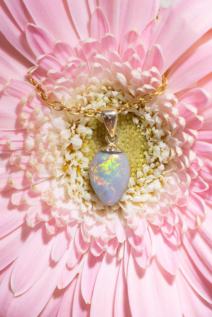 This gorgeous Australian Opal is awash with a rainbow of shimmering colours.