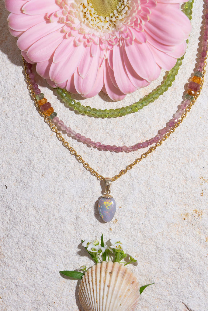 This gorgeous Australian Opal is awash with a rainbow of shimmering colours.