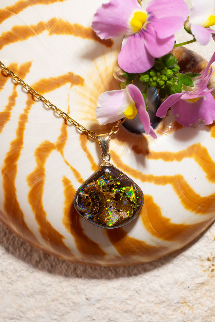 A beautiful statement piece with striking green & gold flashes this Australia boulder opal are truly eye catching.