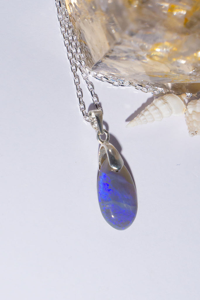 This opal pendant is as soft and pretty as a mist from the ocean with soft blue and mauve colours.