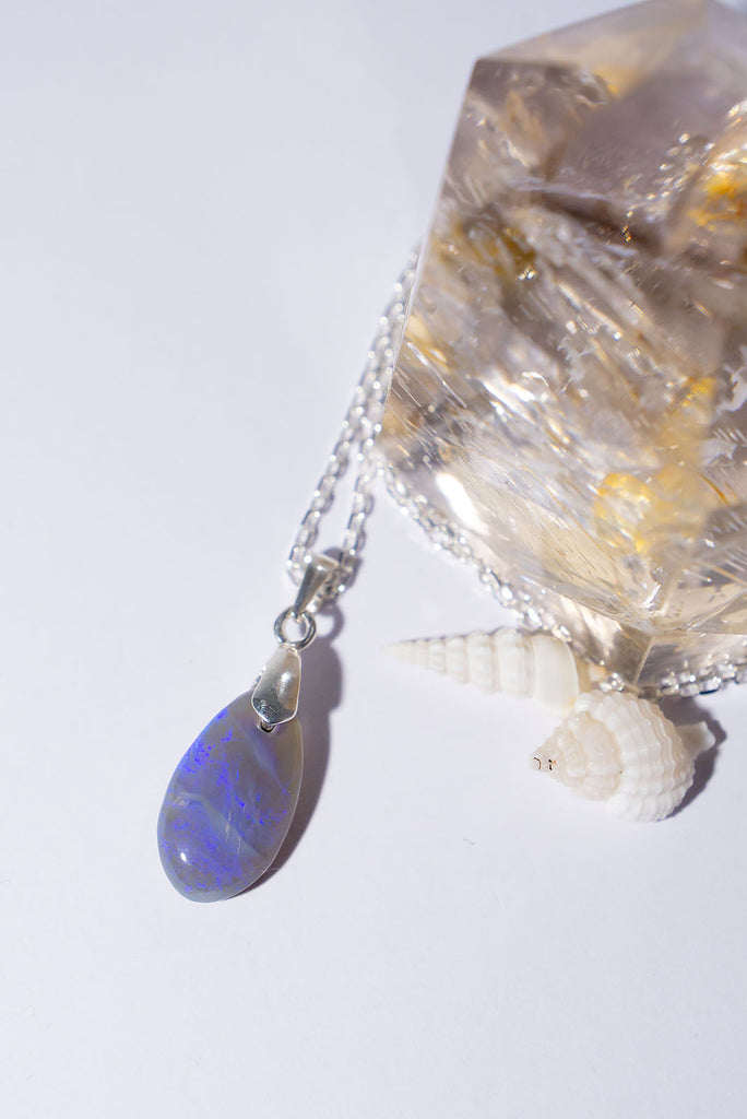 This opal pendant is as soft and pretty as a mist from the ocean with soft blue and mauve colours.