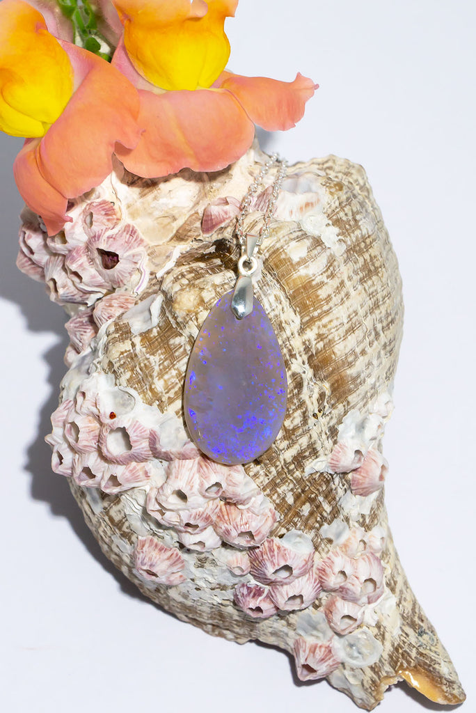 Magical swirls of blue & purple shimmer within this beautiful misty crystal pendant.