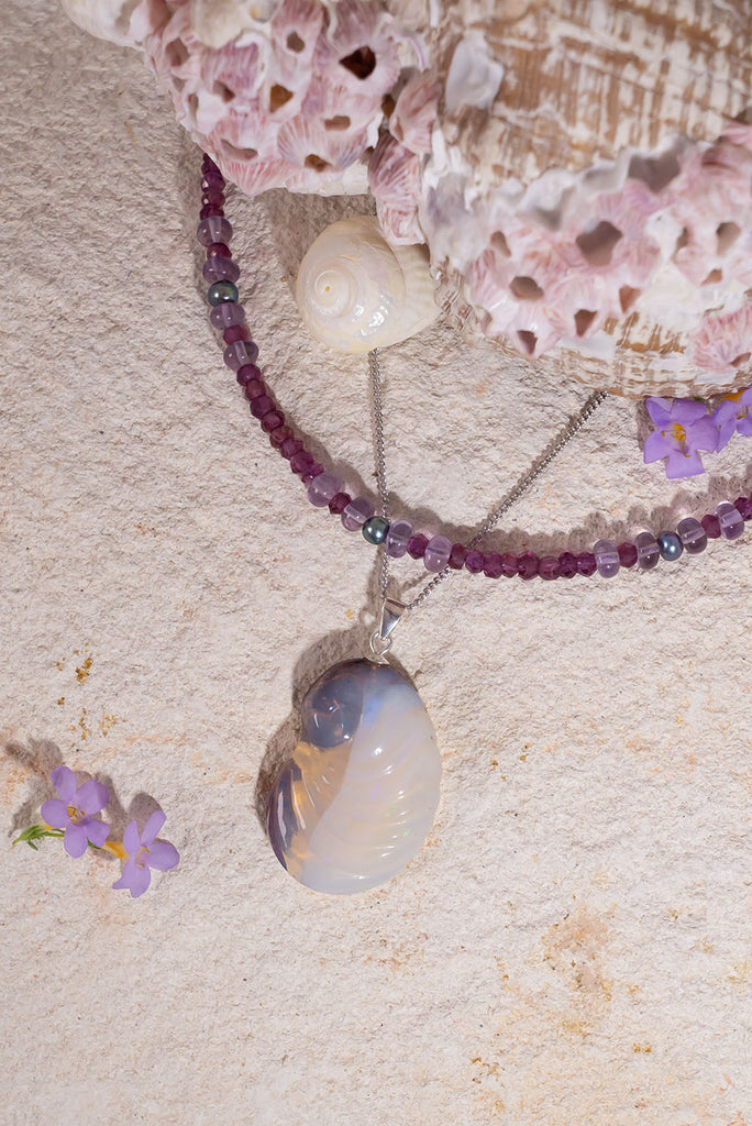 Not just a seashell from the seashore, this magical nautilus pendant is carved in solid Australia opal. This unique one of a kind piece was carved in Noosa, Queensland from locally sourced opal rough.
