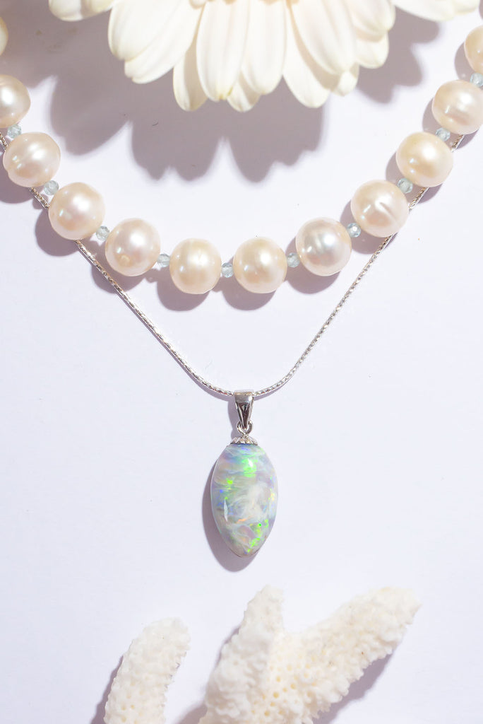 The enthralling colour play in this stunning solid Australian opal pendant is truly exceptional. Within this stone you will find a beautiful bright rolling green flash that needs no extra light to shine and a gorgeous overlay of glowing blue fire crystal opal.