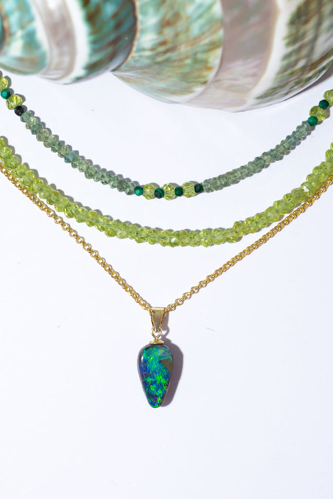 A swirling reef of sea green and blue sparkling opal fire. This beautiful solid Australian Opal pendant is an enchanting and eye catching piece.