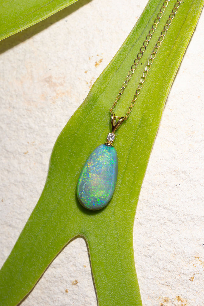 his pendant is the most beautiful semi black crystal Opal, it swirls with intense greens and blue visible at any angle.


9.9ct solid natural semi black Australian Opal.
Cut and polished into an elegant oval to best enhance the intense blue and green colours.
The pendant bail is 18k solid gold with a 1pt white natural diamond.