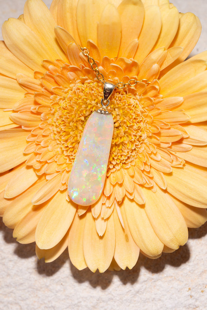 Discover the exquisite beauty of our stunning new Pendant Australian Sunrise Ripple. Each side of this piece has an amazing and different fire. The first side features an intense rolling flagstone pattern with predominately red, peach and gold fire. The second side has a sparkling kaleidoscope colours.