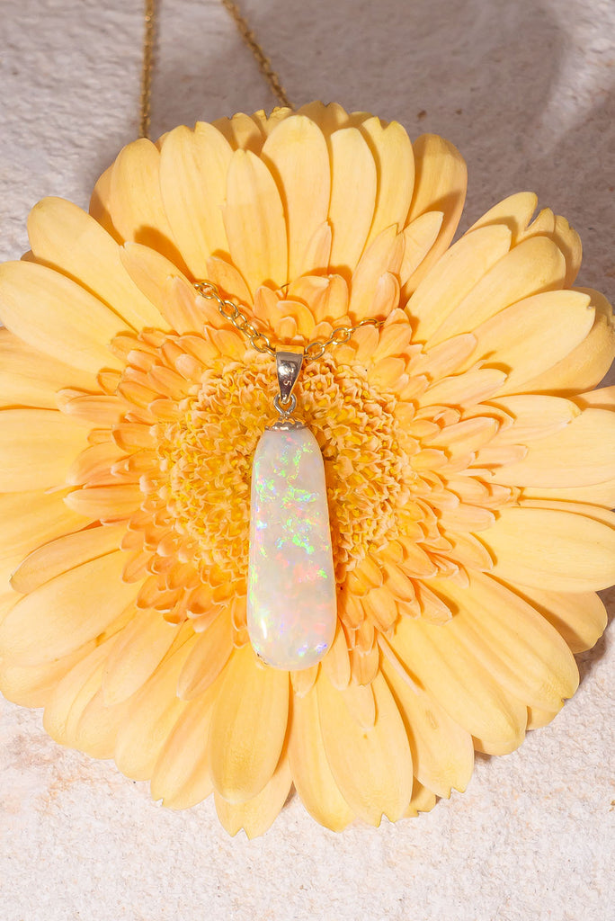 Discover the exquisite beauty of our stunning new Pendant Australian Sunrise Ripple. Each side of this piece has an amazing and different fire. The first side features an intense rolling flagstone pattern with predominately red, peach and gold fire. The second side has a sparkling kaleidoscope colours.