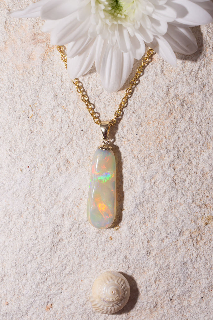 Discover the exquisite beauty of our stunning new Pendant Australian Sunrise Ripple. Each side of this piece has an amazing and different fire. The first side features an intense rolling flagstone pattern with predominately red, peach and gold fire. The second side has a sparkling kaleidoscope colours.