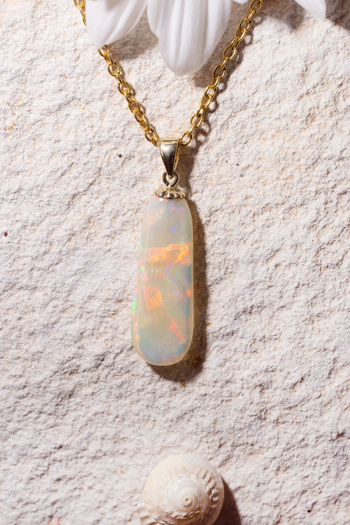 Discover the exquisite beauty of our stunning new Pendant Australian Sunrise Ripple. Each side of this piece has an amazing and different fire. The first side features an intense rolling flagstone pattern with predominately red, peach and gold fire. The second side has a sparkling kaleidoscope colours.